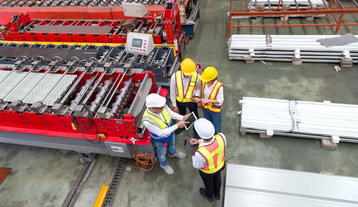 Sustainability expert performing a double materiality assessment with manufacturing crew