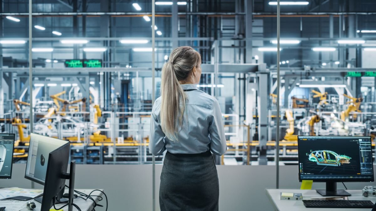 Woman overseeing manufacturing operation